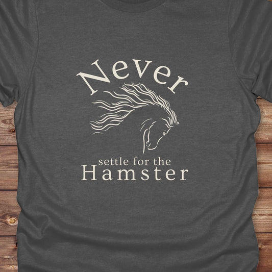 "Never Settle for the Hamster" T-shirt a funny and empowering western tee designed for horse lovers, cowgirls, and cowboy humor fans. Bold typography and flowing horse graphic, perfect for rodeo events, country fairs, or everyday ranch life. Whether you're buying for yourself or gifting to a wild-hearted horse girl, this shirt makes a statement that’s as fierce as your spirit.