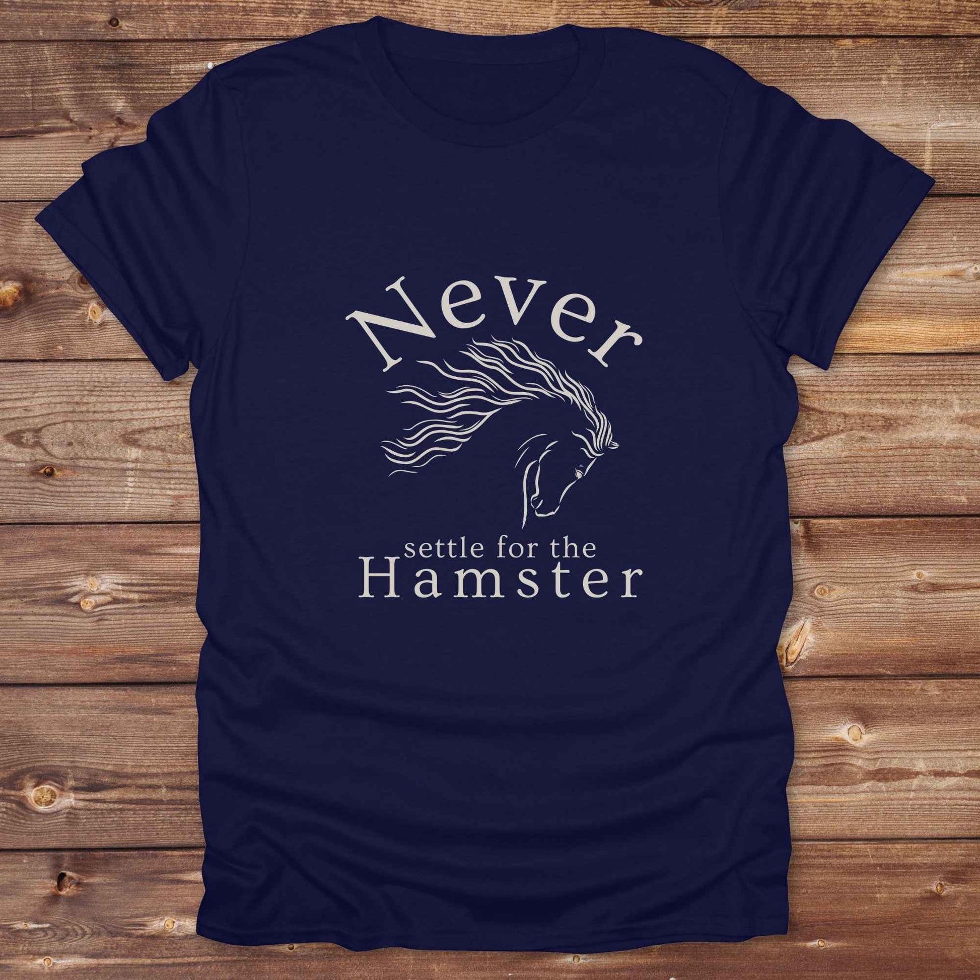 "Never Settle for the Hamster" T-shirt a funny and empowering western tee designed for horse lovers, cowgirls, and cowboy humor fans. Bold typography and flowing horse graphic, perfect for rodeo events, country fairs, or everyday ranch life. Whether you're buying for yourself or gifting to a wild-hearted horse girl, this shirt makes a statement that’s as fierce as your spirit.