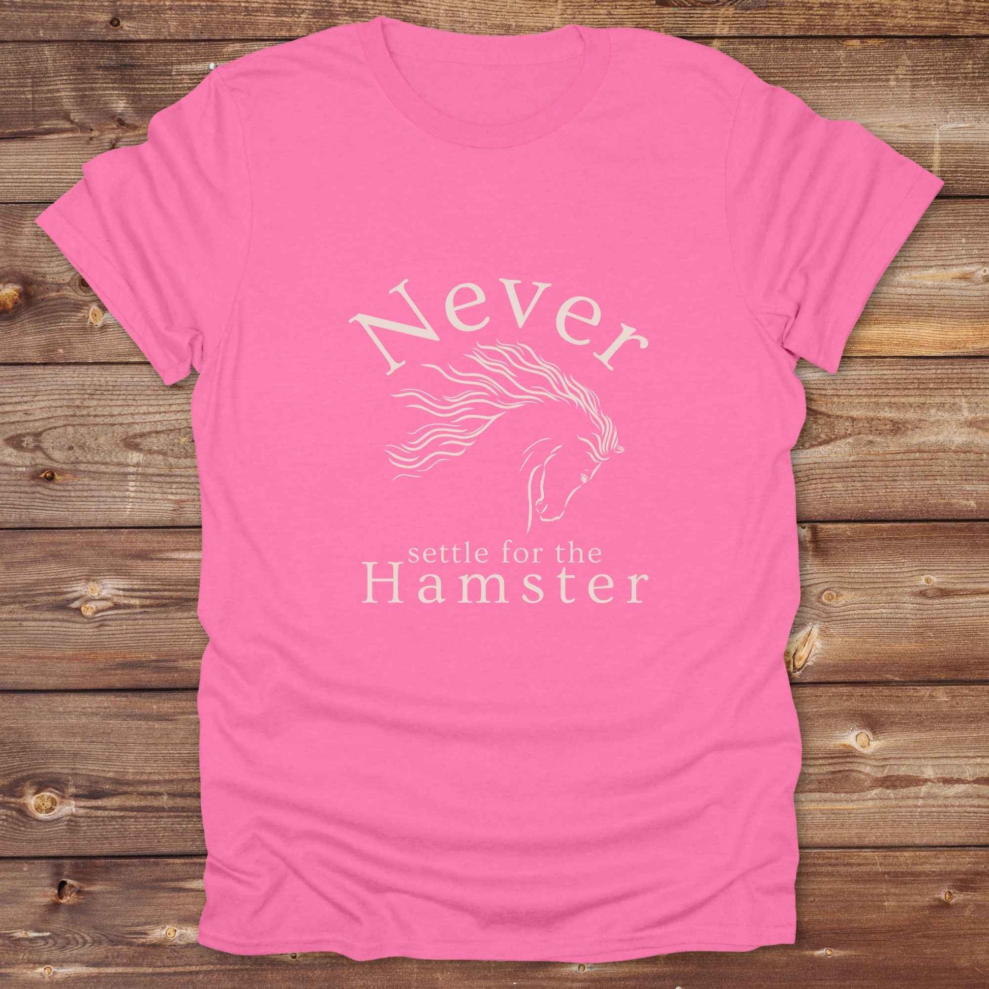 "Never Settle for the Hamster" T-shirt a funny and empowering western tee designed for horse lovers, cowgirls, and cowboy humor fans. Bold typography and flowing horse graphic, perfect for rodeo events, country fairs, or everyday ranch life. Whether you're buying for yourself or gifting to a wild-hearted horse girl, this shirt makes a statement that’s as fierce as your spirit.