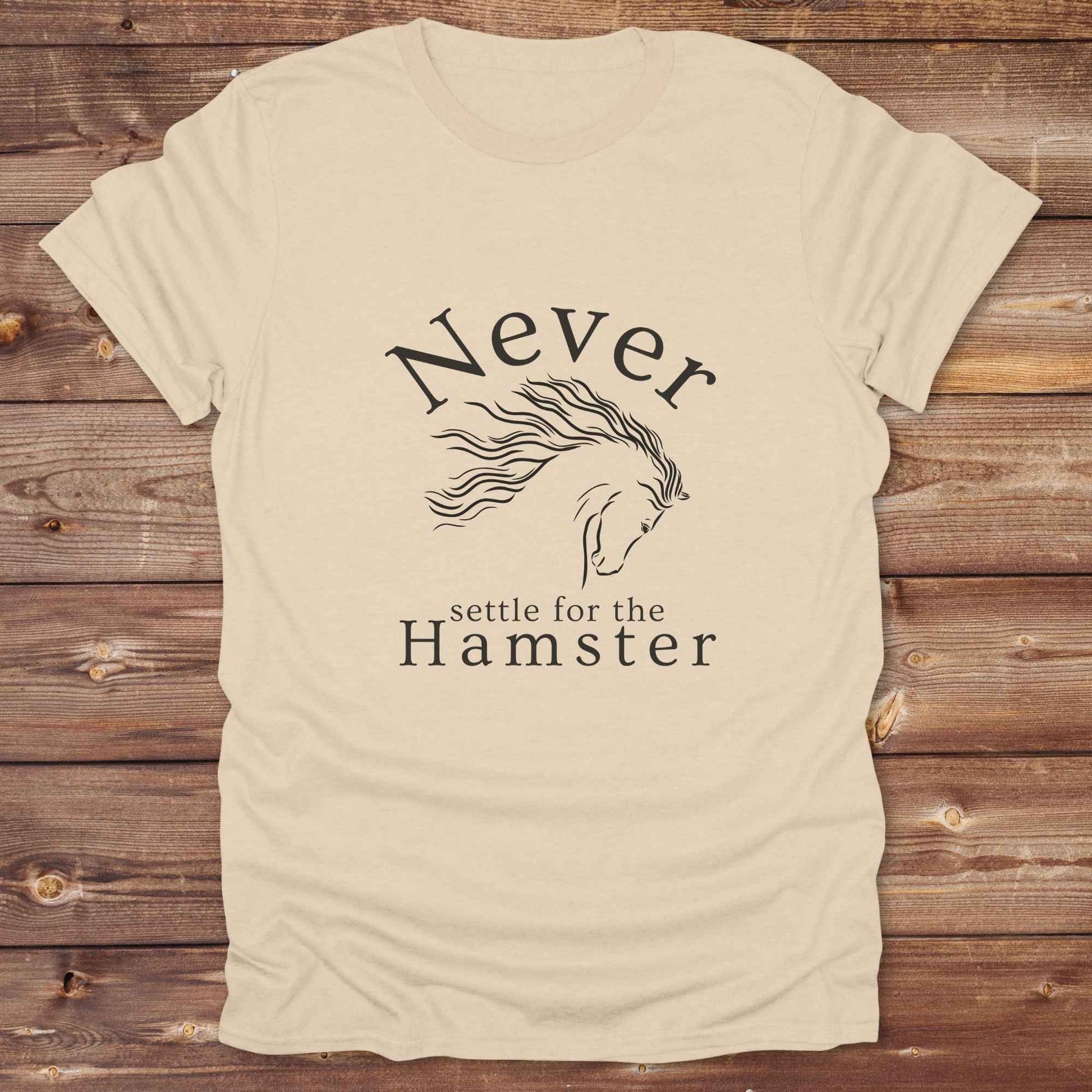 "Never Settle for the Hamster" T-shirt a funny and empowering western tee designed for horse lovers, cowgirls, and cowboy humor fans. Bold typography and flowing horse graphic, perfect for rodeo events, country fairs, or everyday ranch life. Whether you're buying for yourself or gifting to a wild-hearted horse girl, this shirt makes a statement that’s as fierce as your spirit.