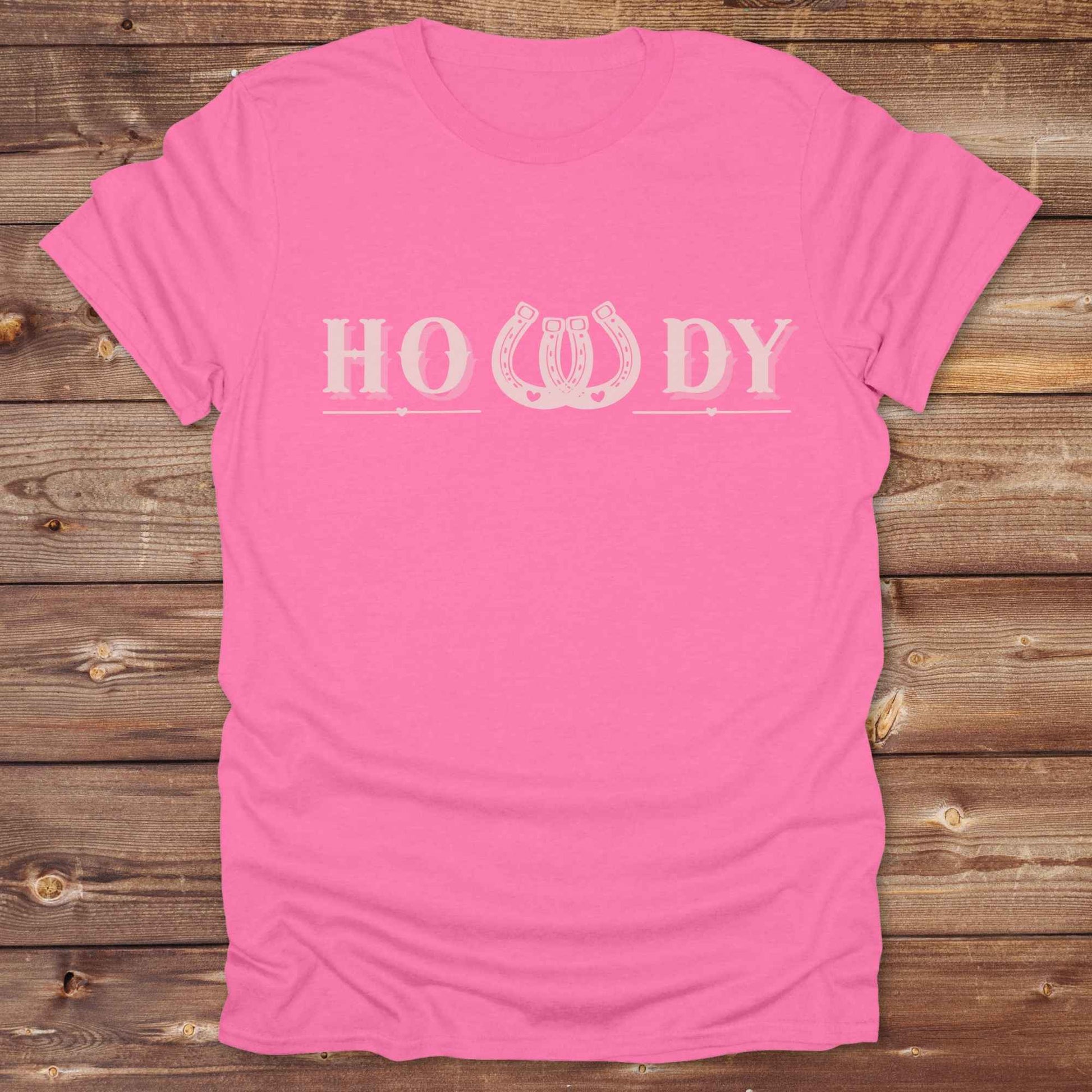 Say “Howdy” in true western style with this rustic horseshoe tee designed for cowboys, cowgirls, and horse lovers alike. Featuring a bold western font and a double horseshoe “W,” this shirt blends southern charm with modern rodeo flair. It's perfect for birthdays, rodeo weekends, country fairs, or just everyday ranch life. Whether you're a rancher, rider, or rural rebel, this shirt adds a little yeehaw to your wardrobe.