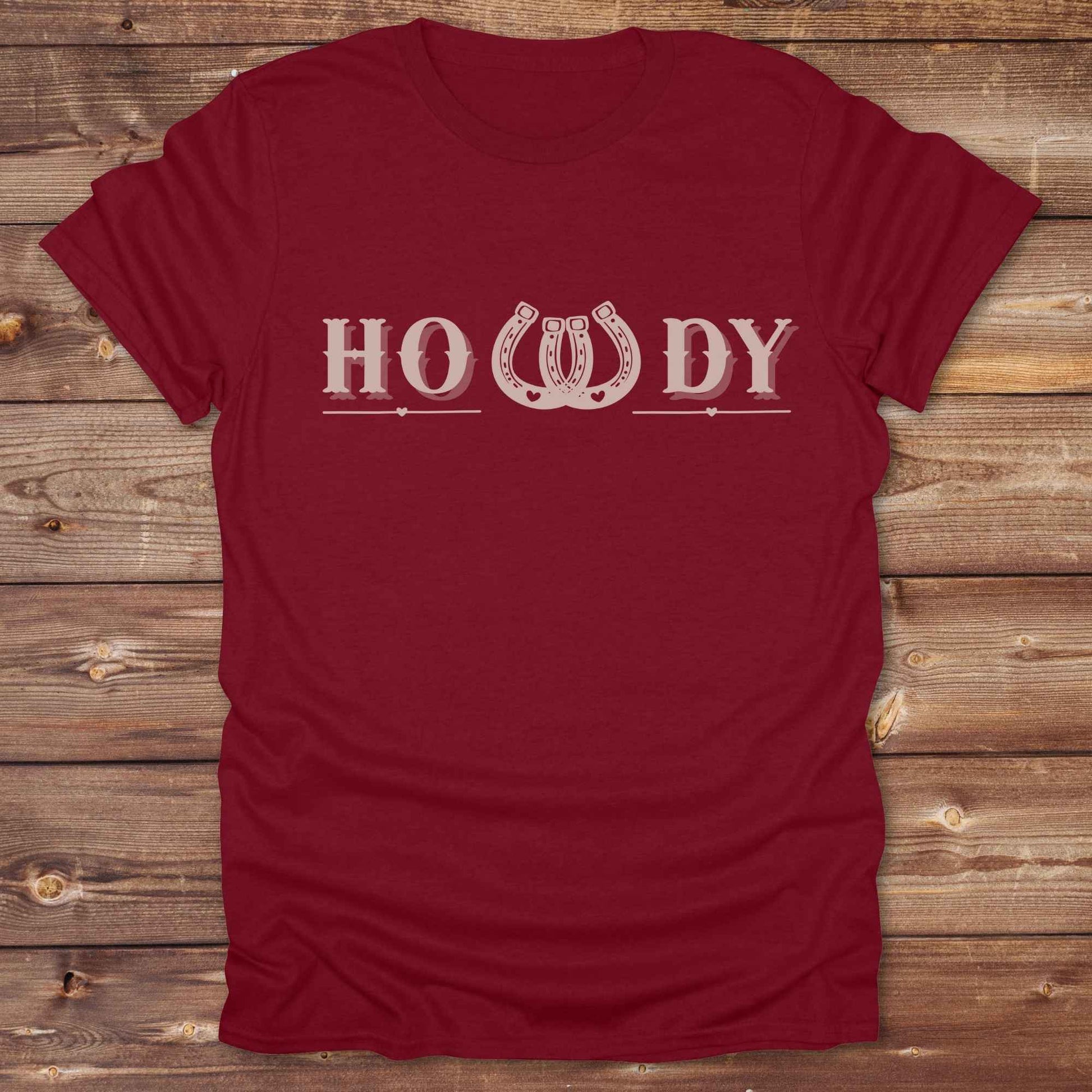 Say “Howdy” in true western style with this rustic horseshoe tee designed for cowboys, cowgirls, and horse lovers alike. Featuring a bold western font and a double horseshoe “W,” this shirt blends southern charm with modern rodeo flair. It's perfect for birthdays, rodeo weekends, country fairs, or just everyday ranch life. Whether you're a rancher, rider, or rural rebel, this shirt adds a little yeehaw to your wardrobe.