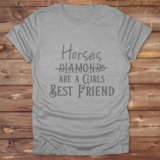 “Horses Are a Girl’s Best Friend” tee from Lasso and Loom is the perfect blend of sass and saddle ready style. Featuring a rustic hand lettered graphic with the word Diamonds cheekily crossed out, this cowgirl shirt celebrates equestrian passion in the most fashionable way. Ideal as a gift for horse lovers, western girls, and rural soul sisters. Whether you're trail riding, shopping small, or posting from the paddock, this shirt says what every horse girl already knows, diamonds don’t ride.