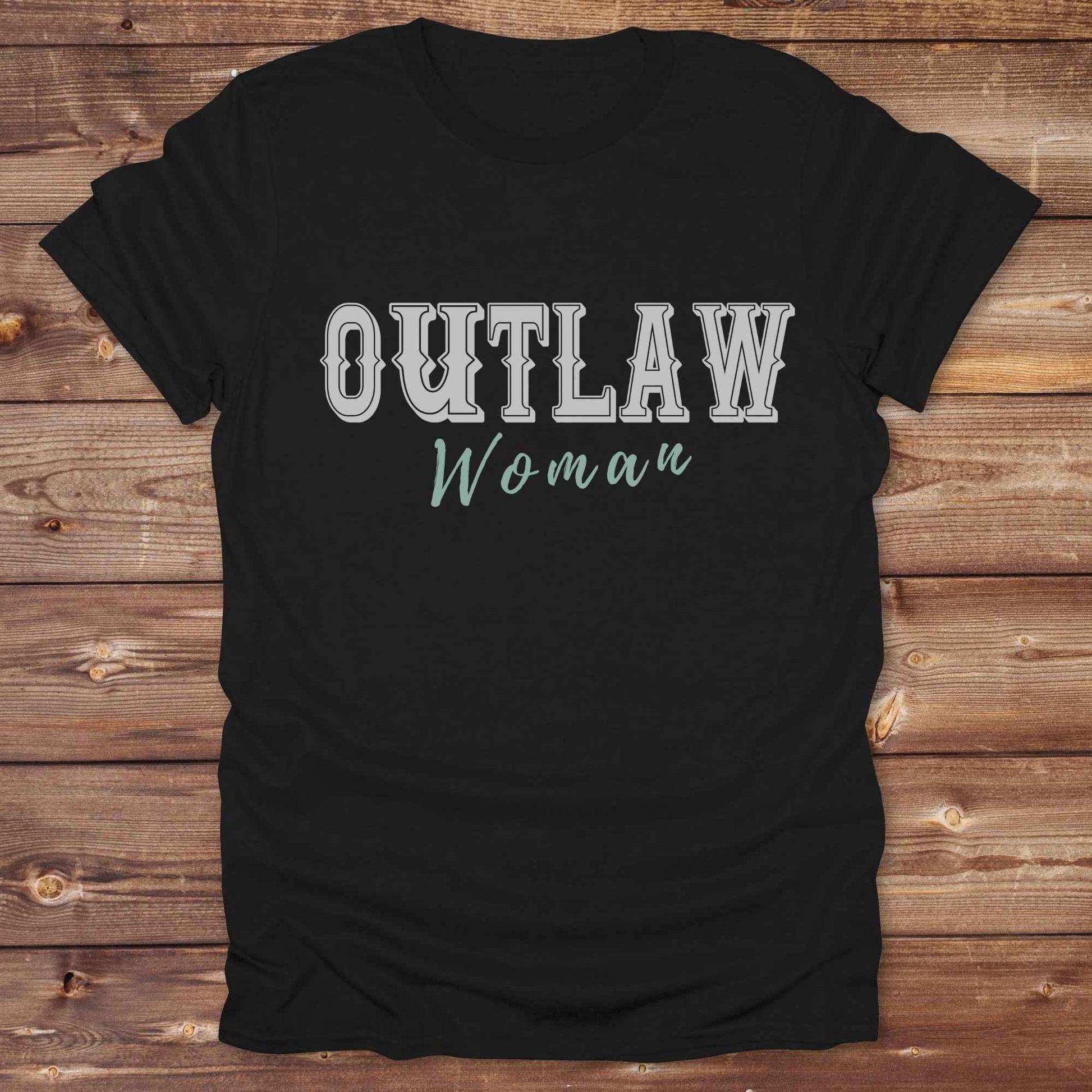 Unleash your inner cowgirl with our Outlaw Woman T-Shirt — a bold, western-inspired tee made for fierce, free-spirited women. Featuring vintage typography and rustic charm, it’s the perfect fit for country girls, rodeo lovers, and horse-riding rebels alike. Ideal as a unique gift or statement piece, this shirt pairs classic outlaw vibes with soft, wearable comfort. Whether you're hitting the trails, rocking the fairgrounds, or lounging in cowgirl style, this tee says you’re wild and proud.