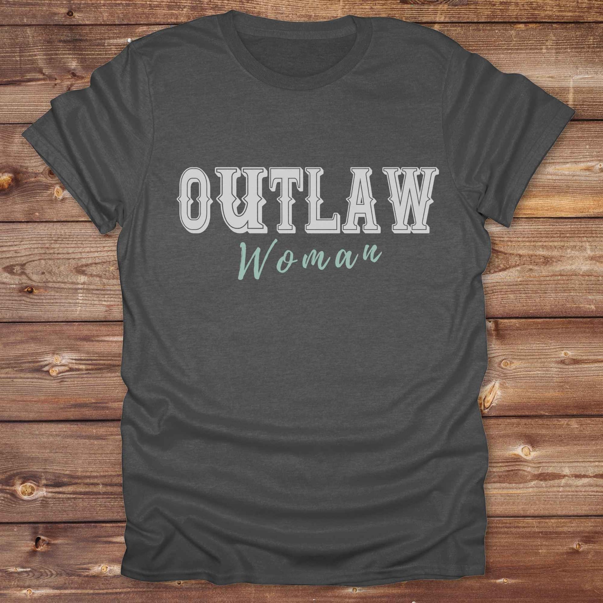 Unleash your inner cowgirl with our Outlaw Woman T-Shirt — a bold, western-inspired tee made for fierce, free-spirited women. Featuring vintage typography and rustic charm, it’s the perfect fit for country girls, rodeo lovers, and horse-riding rebels alike. Ideal as a unique gift or statement piece, this shirt pairs classic outlaw vibes with soft, wearable comfort. Whether you're hitting the trails, rocking the fairgrounds, or lounging in cowgirl style, this tee says you’re wild and proud.