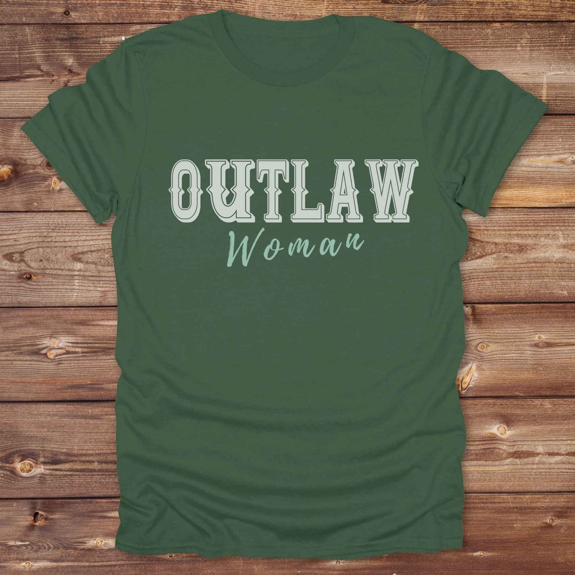 Unleash your inner cowgirl with our Outlaw Woman T-Shirt — a bold, western-inspired tee made for fierce, free-spirited women. Featuring vintage typography and rustic charm, it’s the perfect fit for country girls, rodeo lovers, and horse-riding rebels alike. Ideal as a unique gift or statement piece, this shirt pairs classic outlaw vibes with soft, wearable comfort. Whether you're hitting the trails, rocking the fairgrounds, or lounging in cowgirl style, this tee says you’re wild and proud.