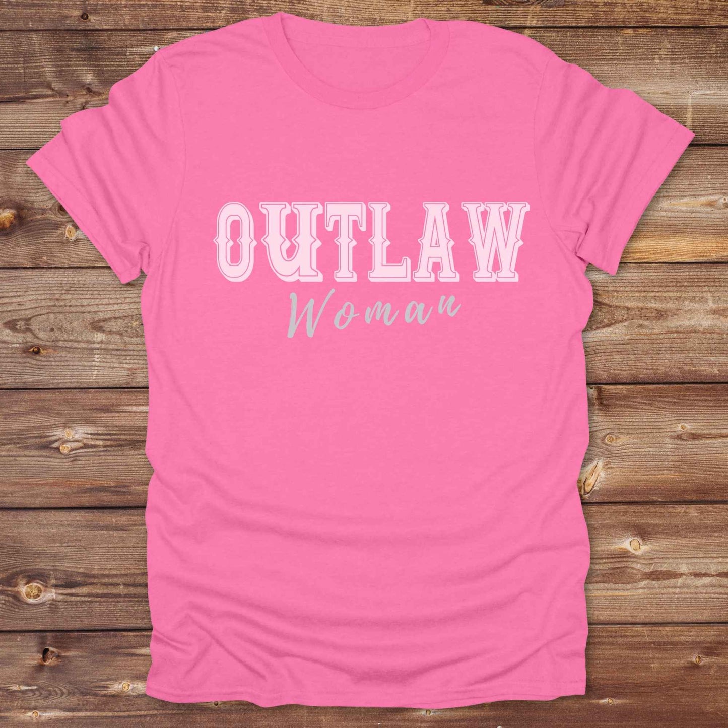 Unleash your inner cowgirl with our Outlaw Woman T-Shirt — a bold, western-inspired tee made for fierce, free-spirited women. Featuring vintage typography and rustic charm, it’s the perfect fit for country girls, rodeo lovers, and horse-riding rebels alike. Ideal as a unique gift or statement piece, this shirt pairs classic outlaw vibes with soft, wearable comfort. Whether you're hitting the trails, rocking the fairgrounds, or lounging in cowgirl style, this tee says you’re wild and proud.