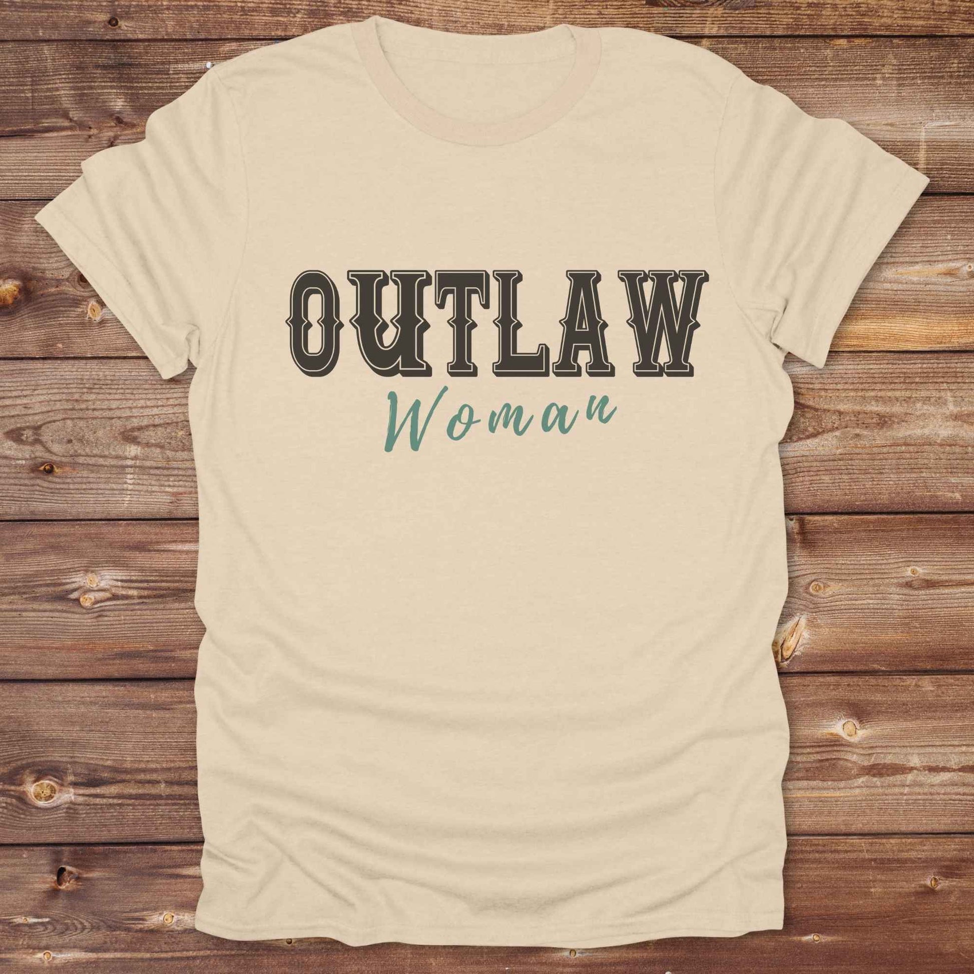 Unleash your inner cowgirl with our Outlaw Woman T-Shirt — a bold, western-inspired tee made for fierce, free-spirited women. Featuring vintage typography and rustic charm, it’s the perfect fit for country girls, rodeo lovers, and horse-riding rebels alike. Ideal as a unique gift or statement piece, this shirt pairs classic outlaw vibes with soft, wearable comfort. Whether you're hitting the trails, rocking the fairgrounds, or lounging in cowgirl style, this tee says you’re wild and proud.