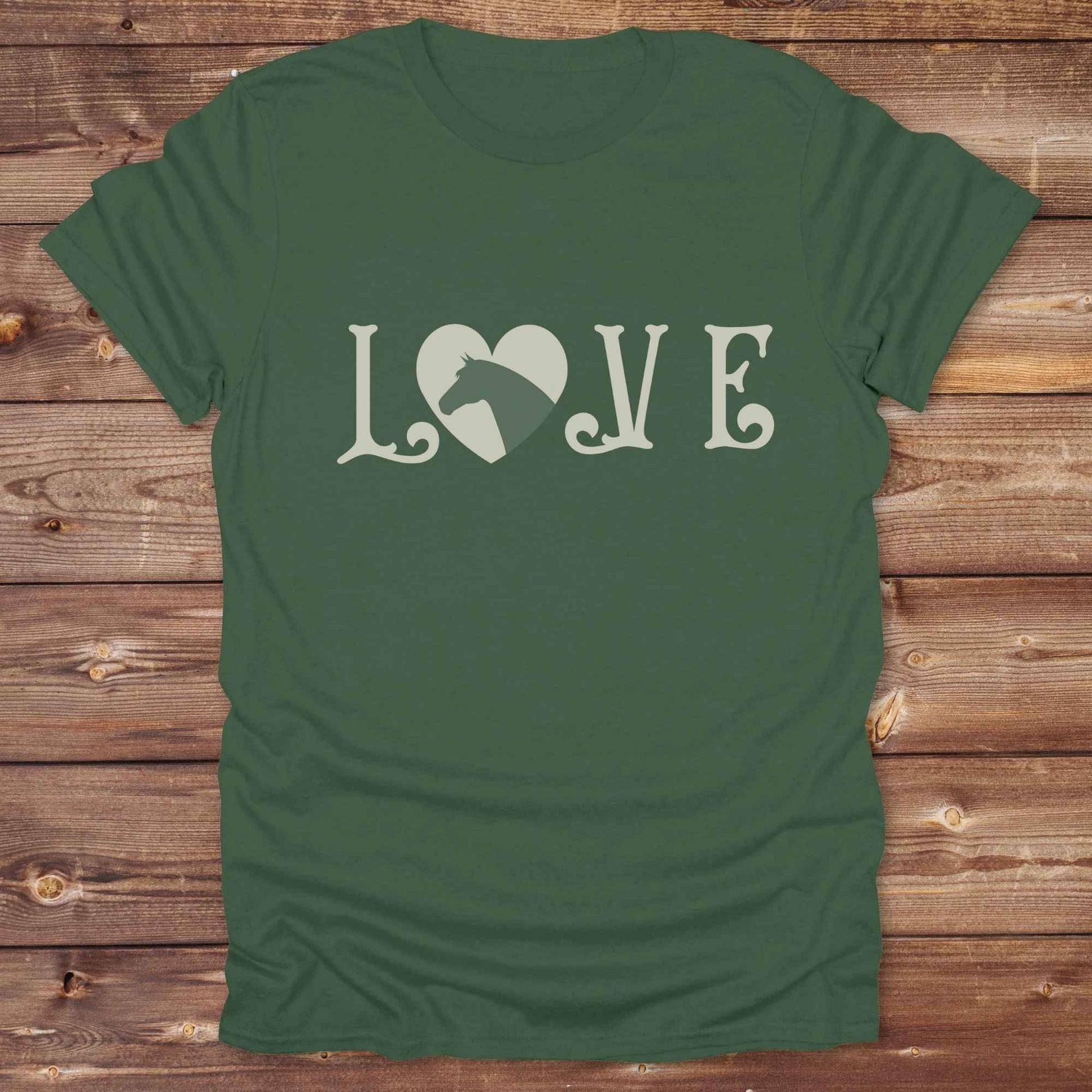 This Love Horses T-Shirt is the perfect expression of passion for horse lovers and cowgirls alike. With a unique heart-and-horse silhouette design and rustic western typography, it makes a thoughtful gift for birthdays, rodeo lovers, equestrians, and country women who live the cowboy lifestyle. The tee pairs well with denim, boots, and a bold cowgirl spirit. Whether for barn days, trail rides, or everyday western fashion, this shirt belongs in your rodeo ready wardrobe.