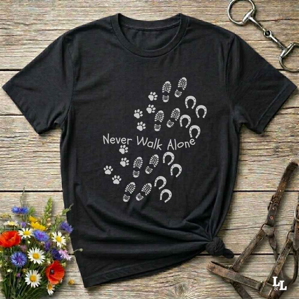 black Cozy unisex horse lover t-shirt featuring a pair of horses and the phrase ‘Never Walk Alone’”