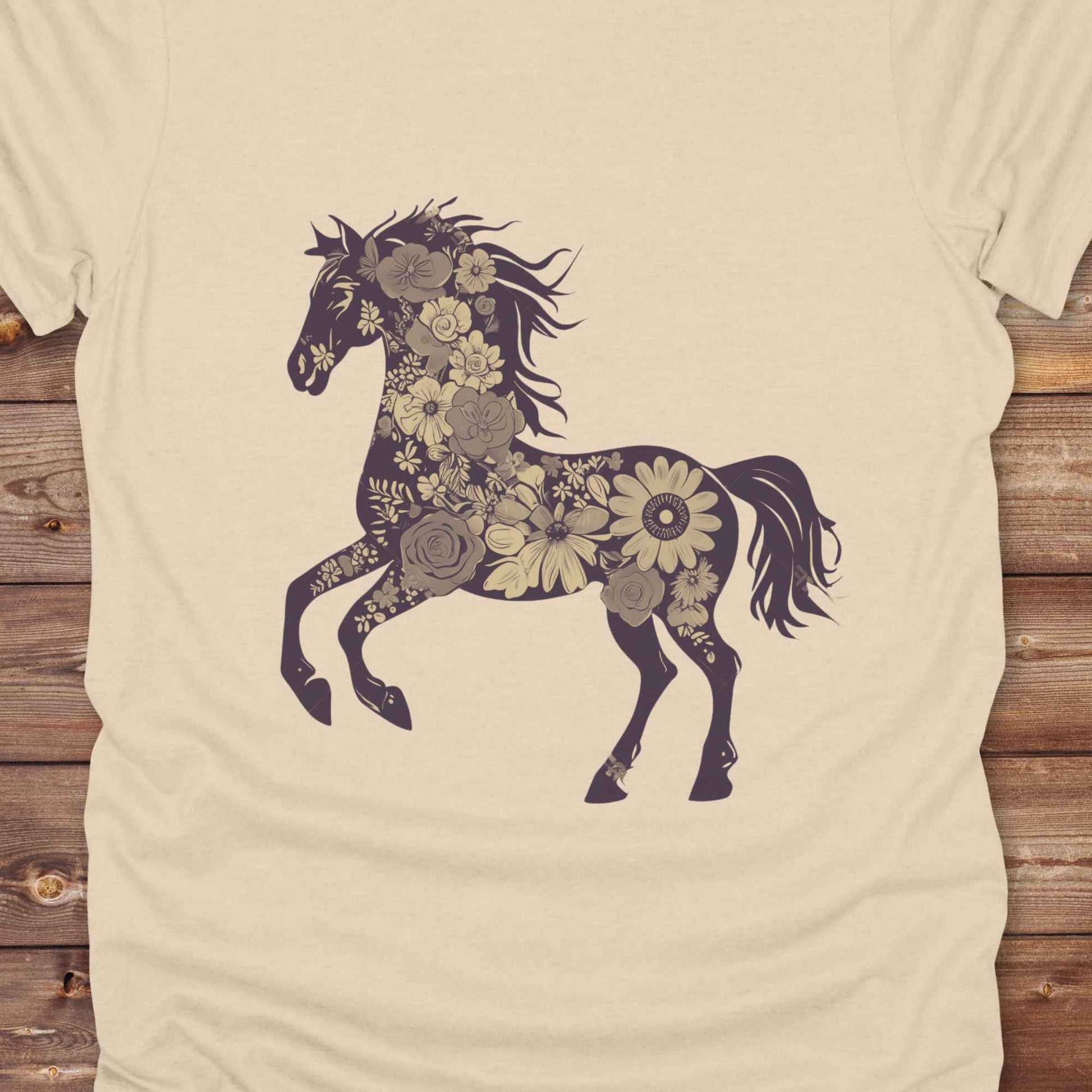 This Boho Flower Horse T-Shirt blends rustic western style with soft feminine charm, featuring a bold silhouette of a galloping mustang filled with intricate floral details. erfect for horse lovers, cowgirls, rodeo fans, and anyone who loves a touch of bohemian elegance in their western wardrobe. Made in 8 beautiful earthy tones, this graphic tee is ideal for birthdays, rodeo days, horse barn adventures, or simply showing off your equestrian spirit in everyday style.