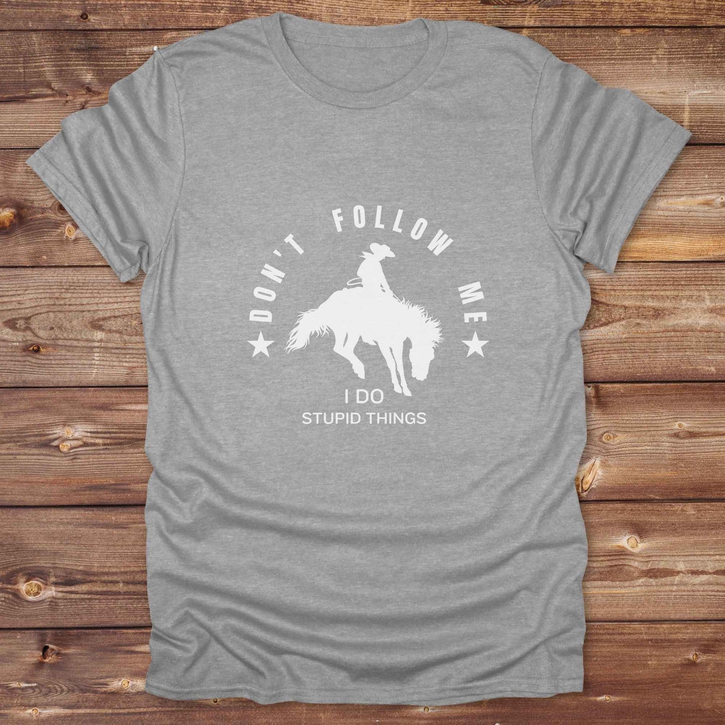 Fun western t-shirt for horse lovers and cowgirls. Western cowgirl graphic tee with horse design. Cowboy humor t-shirt for rodeo and country lovers. Horse lover funny t-shirt with western theme. Country style horse graphic tee for cowboys and cowgirls. Retro style funny western shirt for equestrians. Cute and funny country shirt with horse print. Southern cowgirl funny quote shirt for horse lovers. Dont follow me I do stupid things.