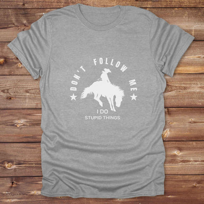 Fun western t-shirt for horse lovers and cowgirls. Western cowgirl graphic tee with horse design. Cowboy humor t-shirt for rodeo and country lovers. Horse lover funny t-shirt with western theme. Country style horse graphic tee for cowboys and cowgirls. Retro style funny western shirt for equestrians. Cute and funny country shirt with horse print. Southern cowgirl funny quote shirt for horse lovers. Dont follow me I do stupid things.
