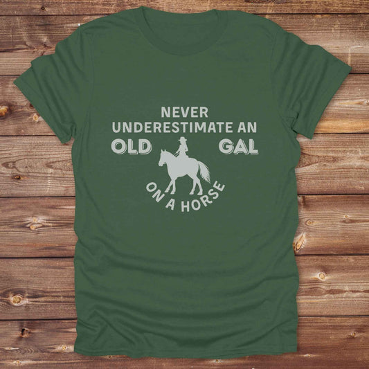 military green Never Underestimate an Old Gal on a Horse T-Shirt. Western Graphic Tee for Horse Lovers.