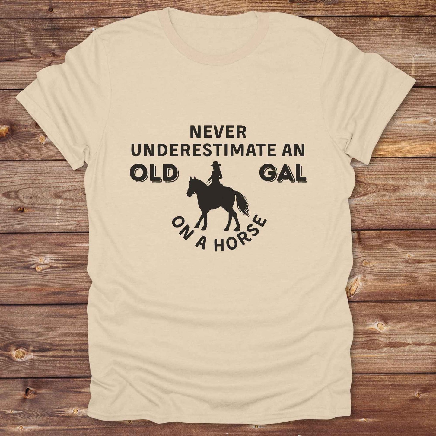 sand beige Never Underestimate an Old Gal on a Horse T-Shirt. Western Graphic Tee for Horse Lovers.