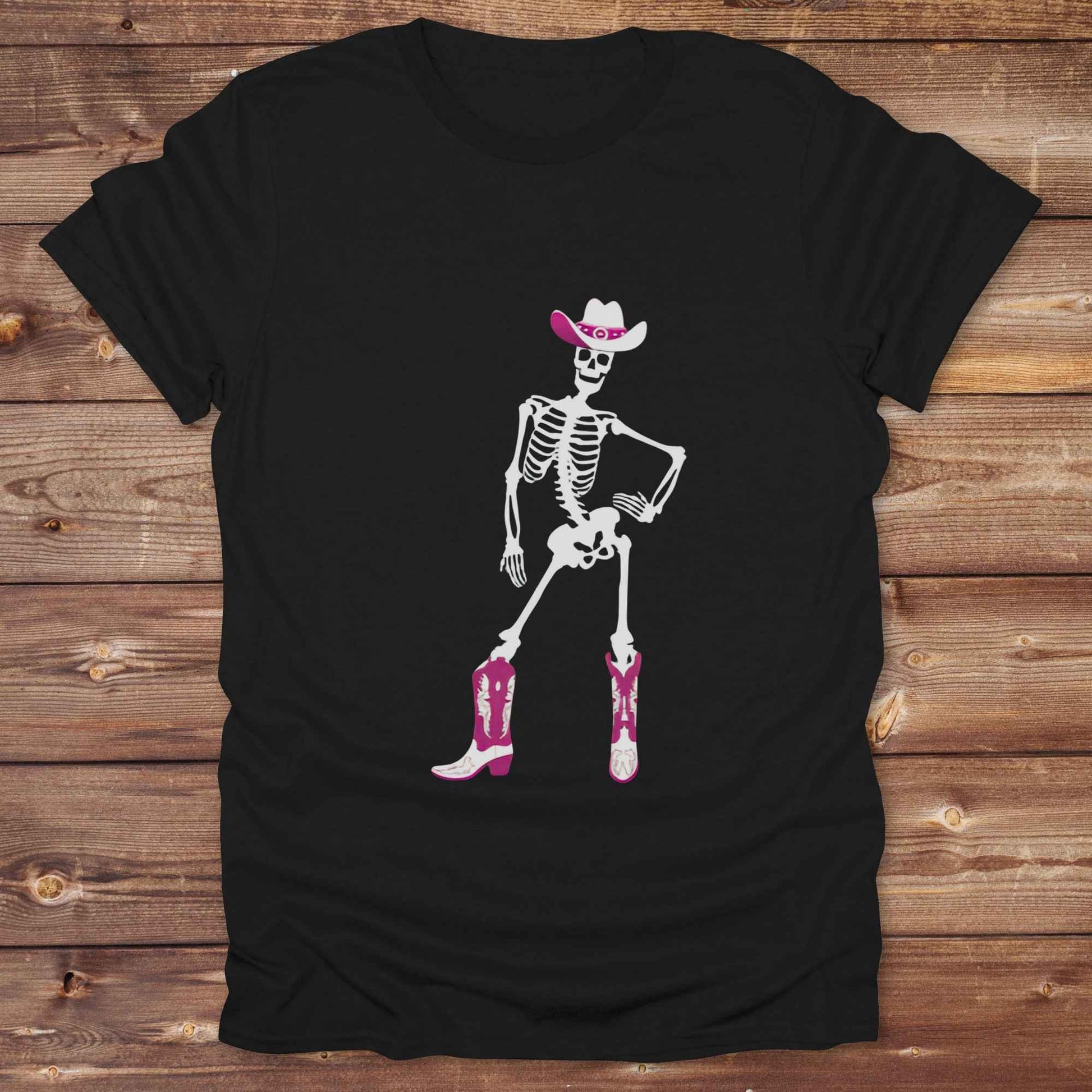 Cowgirl Skeleton T-Shirt is your ultimate spooky-season western tee — perfect for cowgirls, rodeo lovers, and horse fans who want to stand out. Featuring a bold white skeleton in cowboy boots and hat, it’s got that wild west attitude with Halloween sass. For gifting a country girl or dressing for a western Halloween, this tee turns heads and boots up sales. Great for cowgirl birthdays, rodeo fans, and those with spooky southern charm.