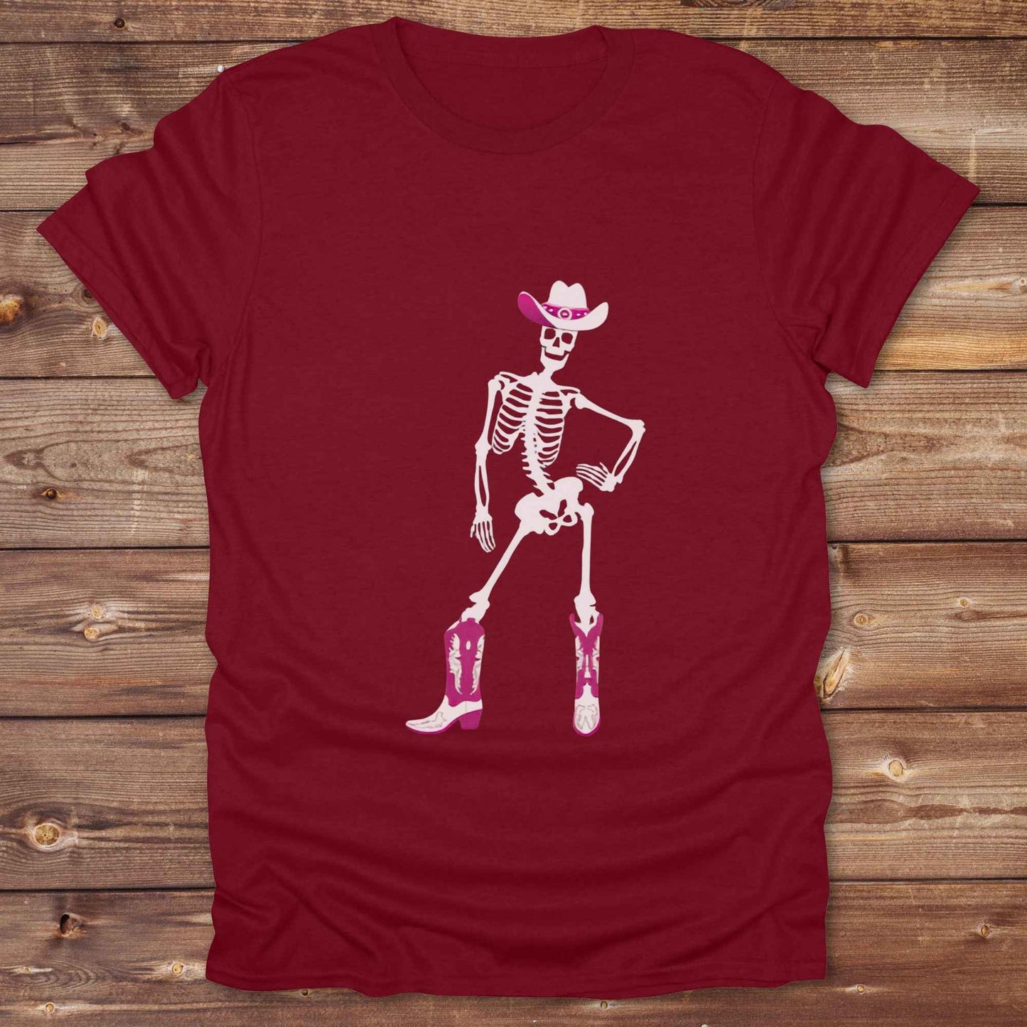 Cowgirl Skeleton T-Shirt is your ultimate spooky-season western tee — perfect for cowgirls, rodeo lovers, and horse fans who want to stand out. Featuring a bold white skeleton in cowboy boots and hat, it’s got that wild west attitude with Halloween sass. For gifting a country girl or dressing for a western Halloween, this tee turns heads and boots up sales. Great for cowgirl birthdays, rodeo fans, and those with spooky southern charm.
