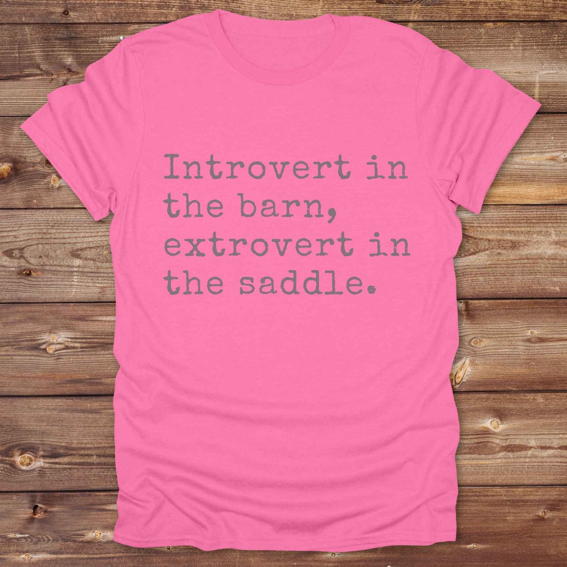 “Introvert in the Barn, Extrovert in the Saddle” t-shirt is the ultimate tee for horse lovers, cowgirls, and western introverts. Whether you're quietly mucking stalls or stealing the show in the arena. made for equestrian souls who ride louder than they talk. Designed with comfort in mind, this western quote shirt is perfect for rodeo nights, barn hangs, or gifting a fellow horse girl.
