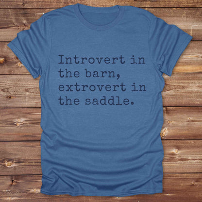 “Introvert in the Barn, Extrovert in the Saddle” t-shirt is the ultimate tee for horse lovers, cowgirls, and western introverts. Whether you're quietly mucking stalls or stealing the show in the arena. made for equestrian souls who ride louder than they talk. Designed with comfort in mind, this western quote shirt is perfect for rodeo nights, barn hangs, or gifting a fellow horse girl.