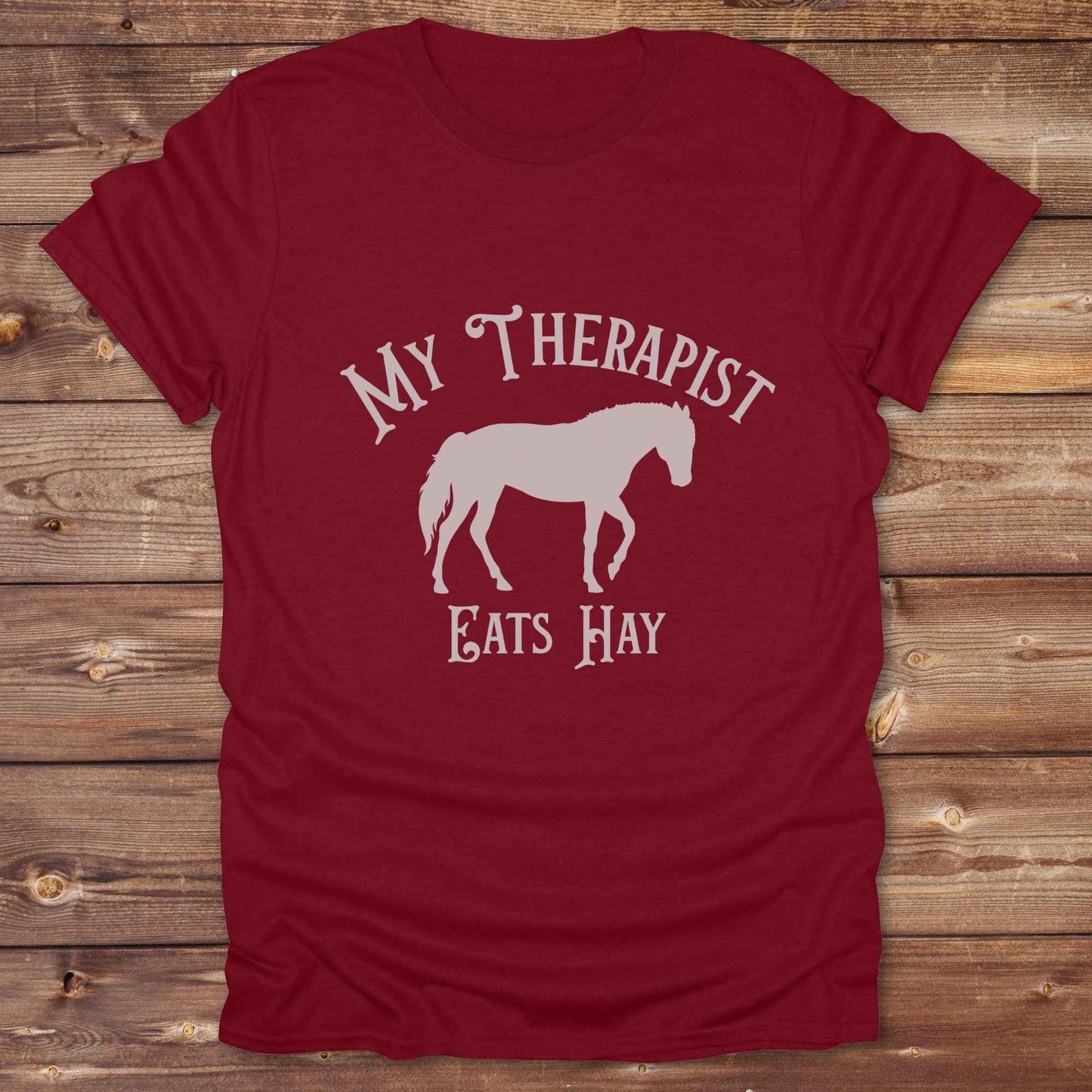 “My Therapist Eats Hay” t-shirt is the perfect mix of humor and horse lover pride, made for cowgirls, cowboys, and western enthusiasts alike. Featuring a bold horse silhouette and vintage western font, it’s ideal for barn days, rodeo nights, or gifting to someone who finds peace in the pasture. Great for birthdays, country events, or just repping your equine therapist with style. Whether you ride for fun or sanity, this western tee keeps the cowboy spirit alive with every wear.