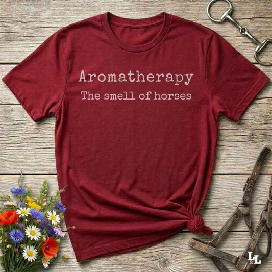 red This "Aromatherapy: The Smell of Horses" t-shirt is perfect for cowgirls, horse moms, and equestrian fans who adore the unmistakable barn scent of saddles, hay, and horses. Designed with rustic charm and equine humor, it makes an ideal gift for western lifestyle lovers, riders, or anyone who finds peace in the smell of a stable. Whether it’s for rodeos, barn events, or lounging in the pasture, this tee says what every true horse lover knows.