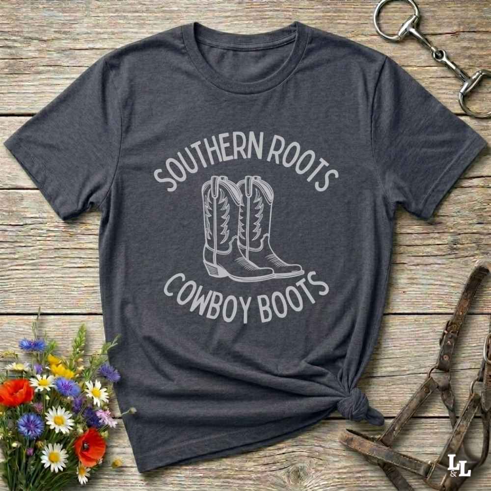 gray tee. Celebrate your country soul with our “Southern Roots Cowboy Boots” graphic tee perfect for cowgirls, rodeo lovers, and anyone who lives for barn life and western fashion. Featuring bold western typography and iconic cowboy boots artwork, this shirt is a must have for horse lovers and southern style fans alike. Ideal for gifts, rodeo events, or everyday rustic living, it’s designed for comfort, style, and soul. Whether you're headed to the stables, the saloon, or Sunday brunch on the farm.