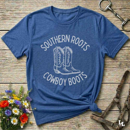 blue tee. Celebrate your country soul with our “Southern Roots Cowboy Boots” graphic tee perfect for cowgirls, rodeo lovers, and anyone who lives for barn life and western fashion. Featuring bold western typography and iconic cowboy boots artwork, this shirt is a must have for horse lovers and southern style fans alike. Ideal for gifts, rodeo events, or everyday rustic living, it’s designed for comfort, style, and soul. Whether you're headed to the stables, the saloon, or Sunday brunch on the farm.