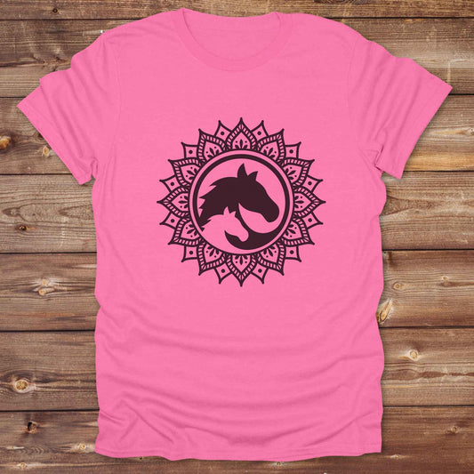 Mandala Horse T-Shirt combines boho spirituality and western soul, perfect for cowgirls, cowboys, horse lovers, and rodeo fans. Features an intricate mandala design with a majestic horse at the center, this tee speaks to those who love rustic country style with spiritual flair. Whether you're trail riding, heading to a barn dance, or simply showing off your equestrian pride, this shirt is the ideal blend of comfort and expression. Designed for mindful western wearers and horse lovers alike, birthdays