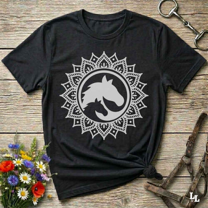 black Mandala Horse T-Shirt combines boho spirituality and western soul, perfect for cowgirls, cowboys, horse lovers, and rodeo fans. Features an intricate mandala design with a majestic horse at the center, this tee speaks to those who love rustic country style with spiritual flair. Whether you're trail riding, heading to a barn dance, or simply showing off your equestrian pride, this shirt is the ideal blend of comfort and expression. Designed for mindful western wearers and horse lovers alike, birthdays