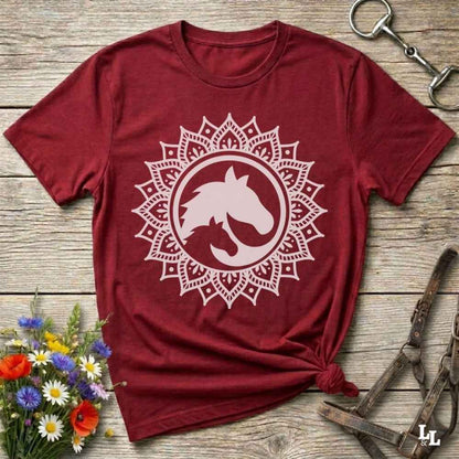 red Mandala Horse T-Shirt combines boho spirituality and western soul, perfect for cowgirls, cowboys, horse lovers, and rodeo fans. Features an intricate mandala design with a majestic horse at the center, this tee speaks to those who love rustic country style with spiritual flair. Whether you're trail riding, heading to a barn dance, or simply showing off your equestrian pride, this shirt is the ideal blend of comfort and expression. Designed for mindful western wearers and horse lovers alike, birthdays
