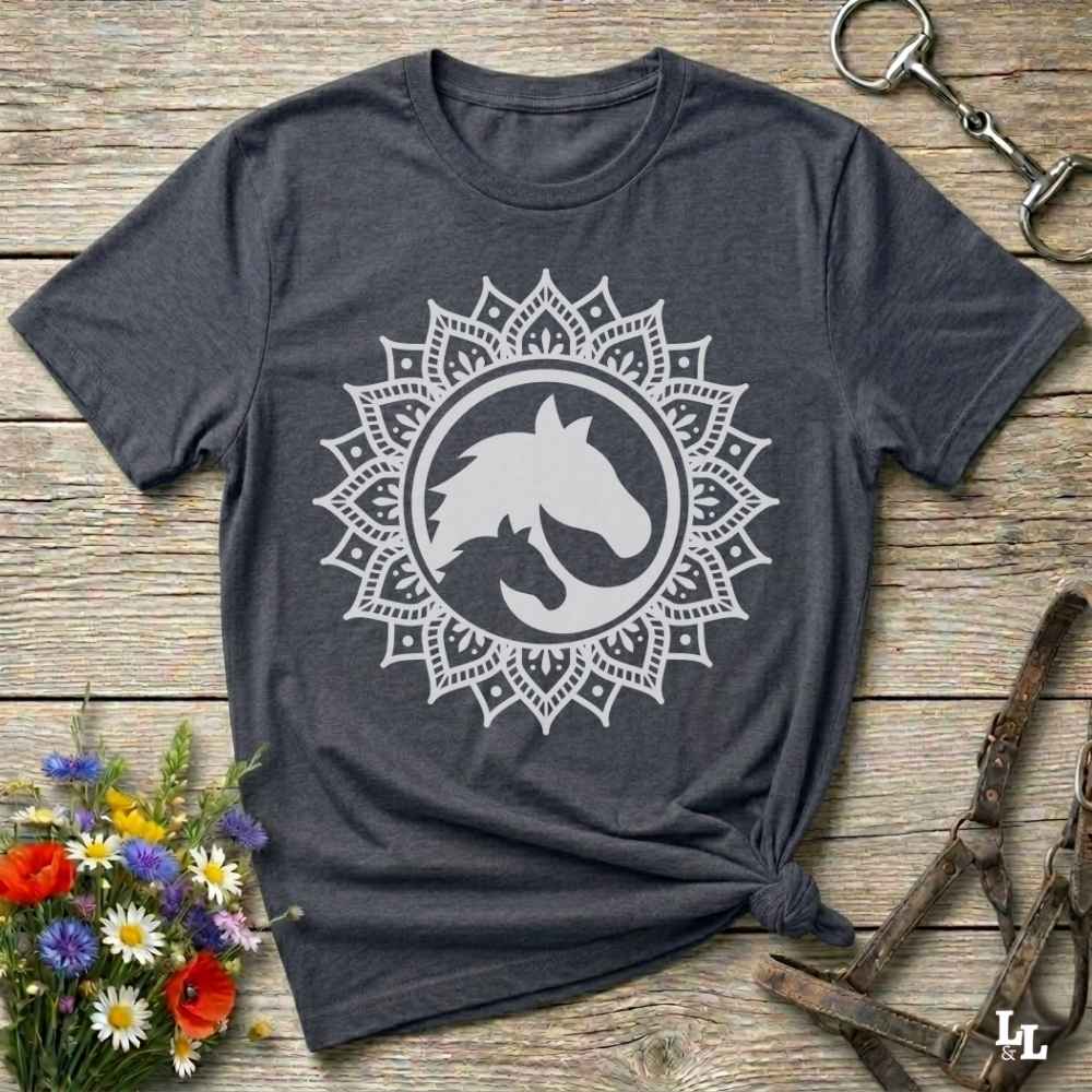 gray Mandala Horse T-Shirt combines boho spirituality and western soul, perfect for cowgirls, cowboys, horse lovers, and rodeo fans. Features an intricate mandala design with a majestic horse at the center, this tee speaks to those who love rustic country style with spiritual flair. Whether you're trail riding, heading to a barn dance, or simply showing off your equestrian pride, this shirt is the ideal blend of comfort and expression. Designed for mindful western wearers and horse lovers alike, birthdays