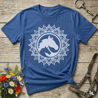 blue Mandala Horse T-Shirt combines boho spirituality and western soul, perfect for cowgirls, cowboys, horse lovers, and rodeo fans. Features an intricate mandala design with a majestic horse at the center, this tee speaks to those who love rustic country style with spiritual flair. Whether you're trail riding, heading to a barn dance, or simply showing off your equestrian pride, this shirt is the ideal blend of comfort and expression. Designed for mindful western wearers and horse lovers alike, birthdays