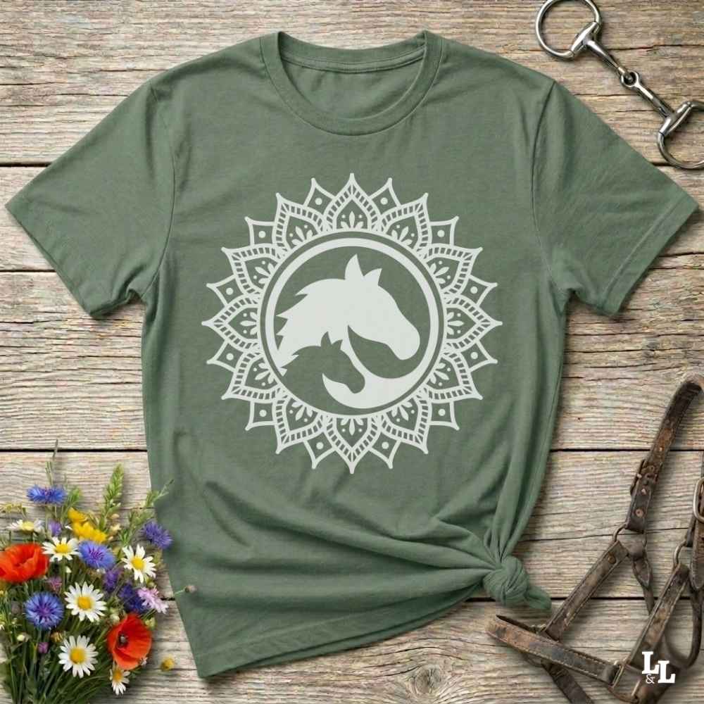 green Mandala Horse T-Shirt combines boho spirituality and western soul, perfect for cowgirls, cowboys, horse lovers, and rodeo fans. Features an intricate mandala design with a majestic horse at the center, this tee speaks to those who love rustic country style with spiritual flair. Whether you're trail riding, heading to a barn dance, or simply showing off your equestrian pride, this shirt is the ideal blend of comfort and expression. Designed for mindful western wearers and horse lovers alike, birthdays