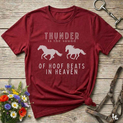 red tee Saddle up with our “Hoof Beats in Heaven” Western Tee – the perfect tribute to your love for horses, riding, and country life. Featuring bold galloping horse graphics and the quote “Thunder is the sound of hoof beats in heaven,” this shirt is made for cowgirls, cowboys, and western soul seekers. Ideal for rodeo lovers, country music fans, and horse memorial gifts. It’s a versatile piece for ranch days, casual outings, or as a thoughtful gift.