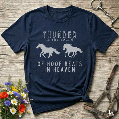 Saddle up with our “Hoof Beats in Heaven” Western navy blue Tee – the perfect tribute to your love for horses, riding, and country life. Featuring bold galloping horse graphics and the quote “Thunder is the sound of hoof beats in heaven,” this shirt is made for cowgirls, cowboys, and western soul seekers. Ideal for rodeo lovers, country music fans, and horse memorial gifts. It’s a versatile piece for ranch days, casual outings, or as a thoughtful gift.