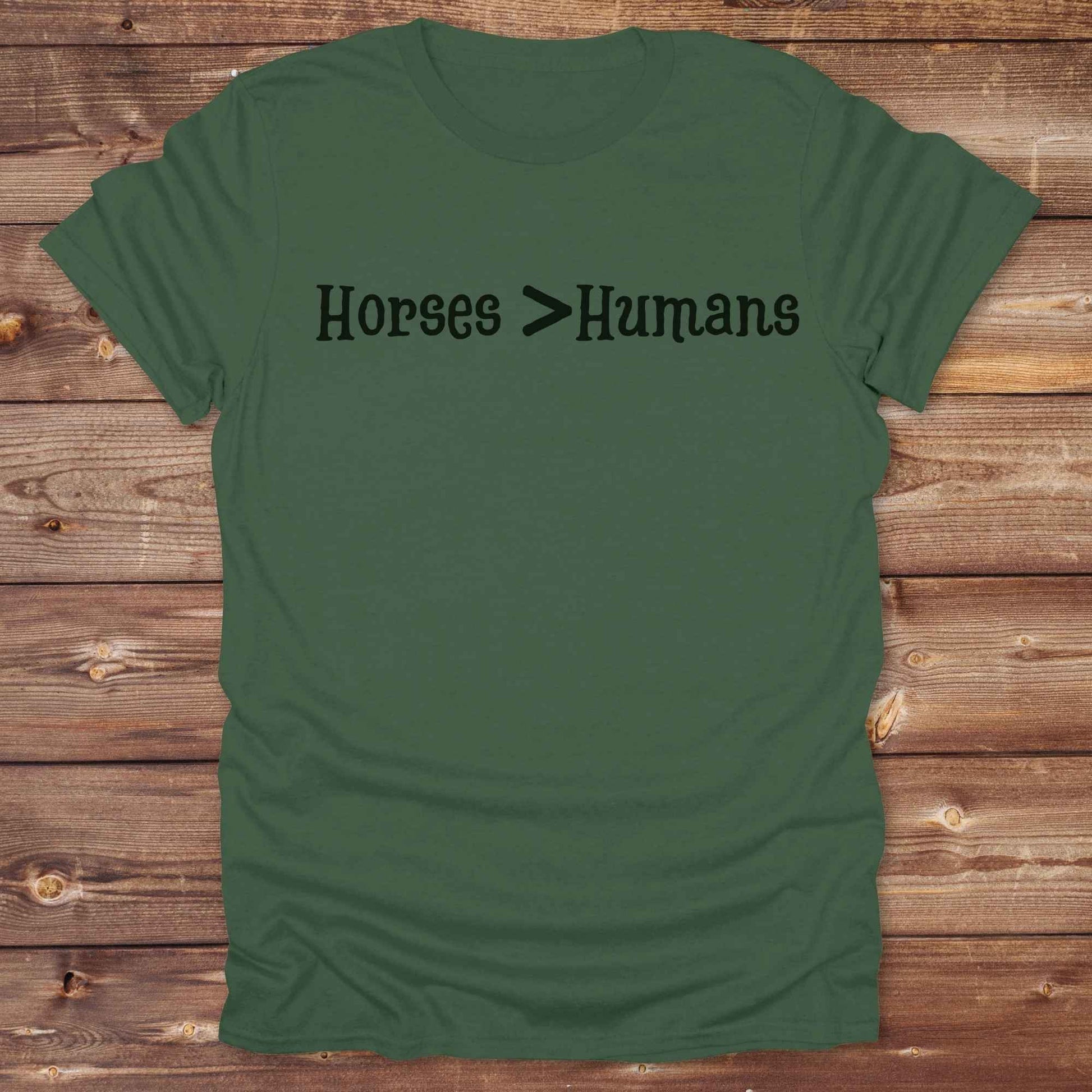 Show off your equestrian spirit with our “Horses > Humans” western t-shirt — made for horse lovers with a sense of humor. This minimal black design says it all: horses are better than people, period. Perfect for cowgirls, cowboys, equestrians, rodeo fans, and sarcastic ranch folk who know where their loyalty lies. Whether you're gifting it to a horse girl or repping it at a rodeo, this tee delivers comfort, country attitude, and all the sass. 