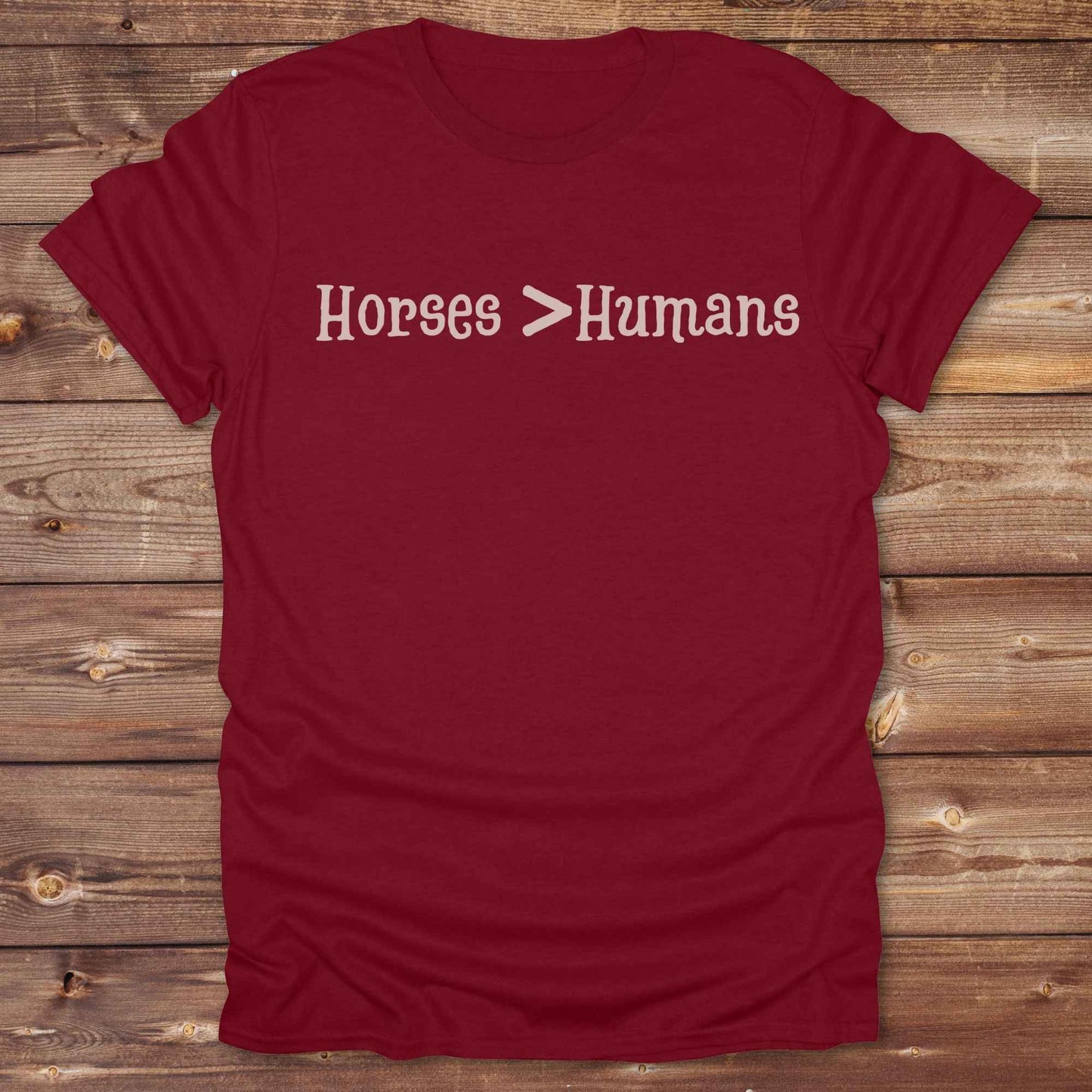 Show off your equestrian spirit with our “Horses > Humans” western t-shirt — made for horse lovers with a sense of humor. This minimal black design says it all: horses are better than people, period. Perfect for cowgirls, cowboys, equestrians, rodeo fans, and sarcastic ranch folk who know where their loyalty lies. Whether you're gifting it to a horse girl or repping it at a rodeo, this tee delivers comfort, country attitude, and all the sass. 