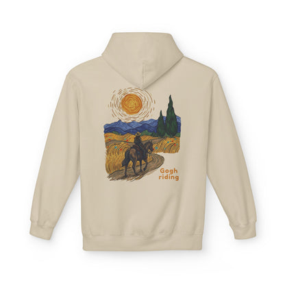 A beige pullover hoodie shown from the back, featuring a colorful graphic print of a rider on horseback in a stylized landscape reminiscent of Van Gogh, with the text 'Gogh riding' printed below.