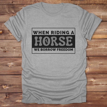 Wear your spirit of freedom with our Borrow Freedom Horse T‑Shirt. Perfect for cowgirls, cowboys, rodeo lovers, and horse enthusiasts, this western graphic tee combines vintage charm with modern comfort. A standout gift idea for birthdays, anniversaries, or just because this unisex horse lover shirt elevates country style while celebrating equestrian passion.