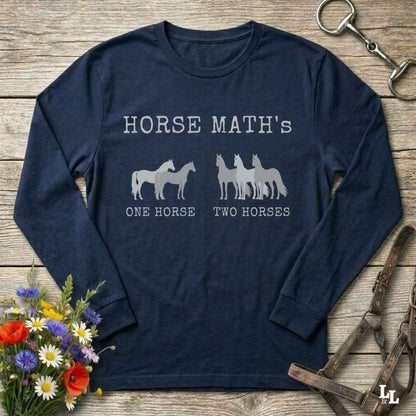 Black long-sleeve shirt with horse-themed text and graphics on a wooden surface with floral and equestrian accessories.