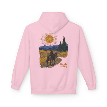 A light pink pullover hoodie shown from the back, featuring a stylized graphic print inspired by Van Gogh's 'Starry Night' with a rider on a horse, a bright sun, and the text 'Gogh riding'.