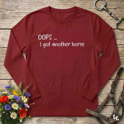 A red long-sleeve t-shirt with the text 'OOPS ... I got another horse'