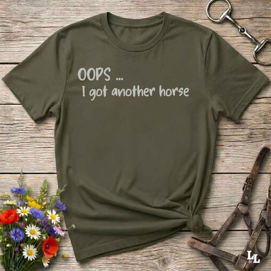 An olive green short-sleeve t-shirt with the text 'OOPS .... I got another horse'