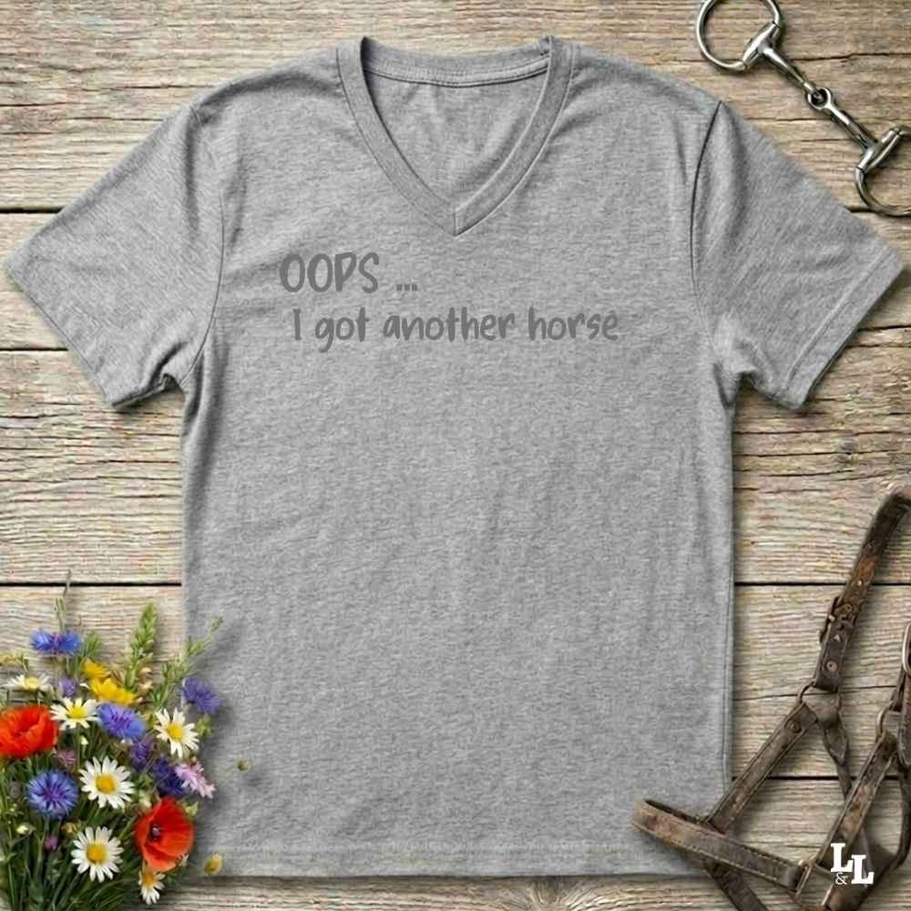 A heather gray V-neck t-shirt with the text 'OOPS.