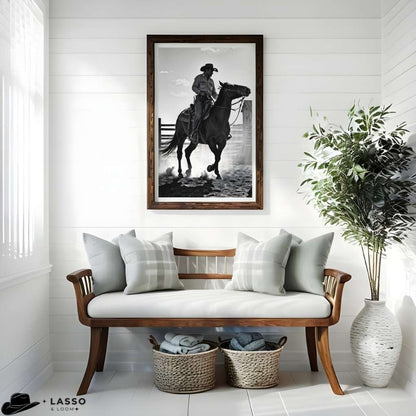 Living room with wooden bench, framed black and white artwork of a cowboy on horseback, and decorative elements.