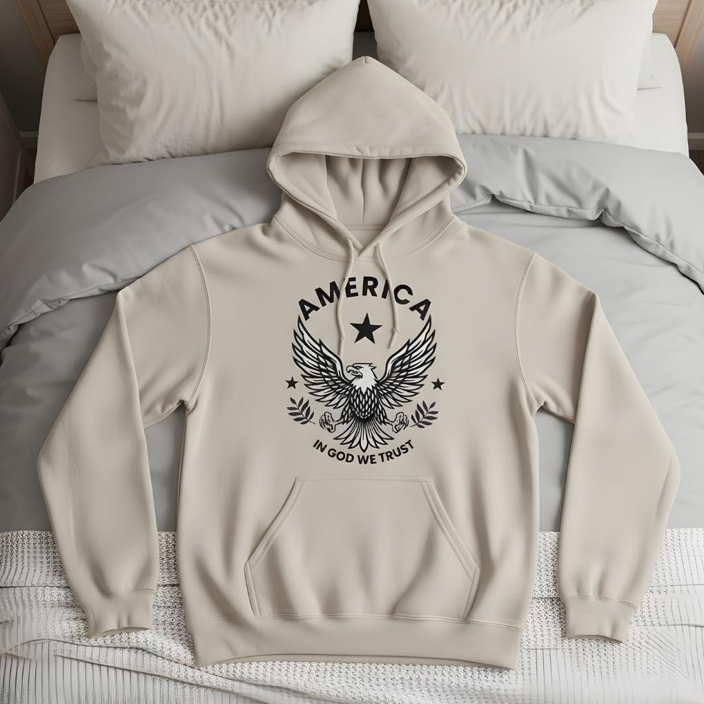 Beige hoodie with eagle design and text on a bed. America Eagle Hoodie for Horse Lovers, Western Style Hoodie, Barn Apparel