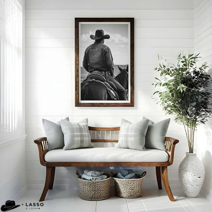 Living room with a wooden bench, framed picture of a person on horseback, and decorative elements.