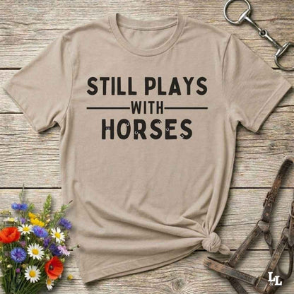 beige Fun western t-shirt for horse lovers and cowgirls. Western cowgirl graphic tee with horse design. Cowboy humor t-shirt for rodeo and country lovers. Horse lover funny t-shirt with western theme. Country style horse graphic tee for cowboys and cowgirls. Retro style funny western shirt for equestrians. Cute and funny country shirt with horse print. Southern cowgirl funny quote shirt for horse lovers. Still plays with horses.