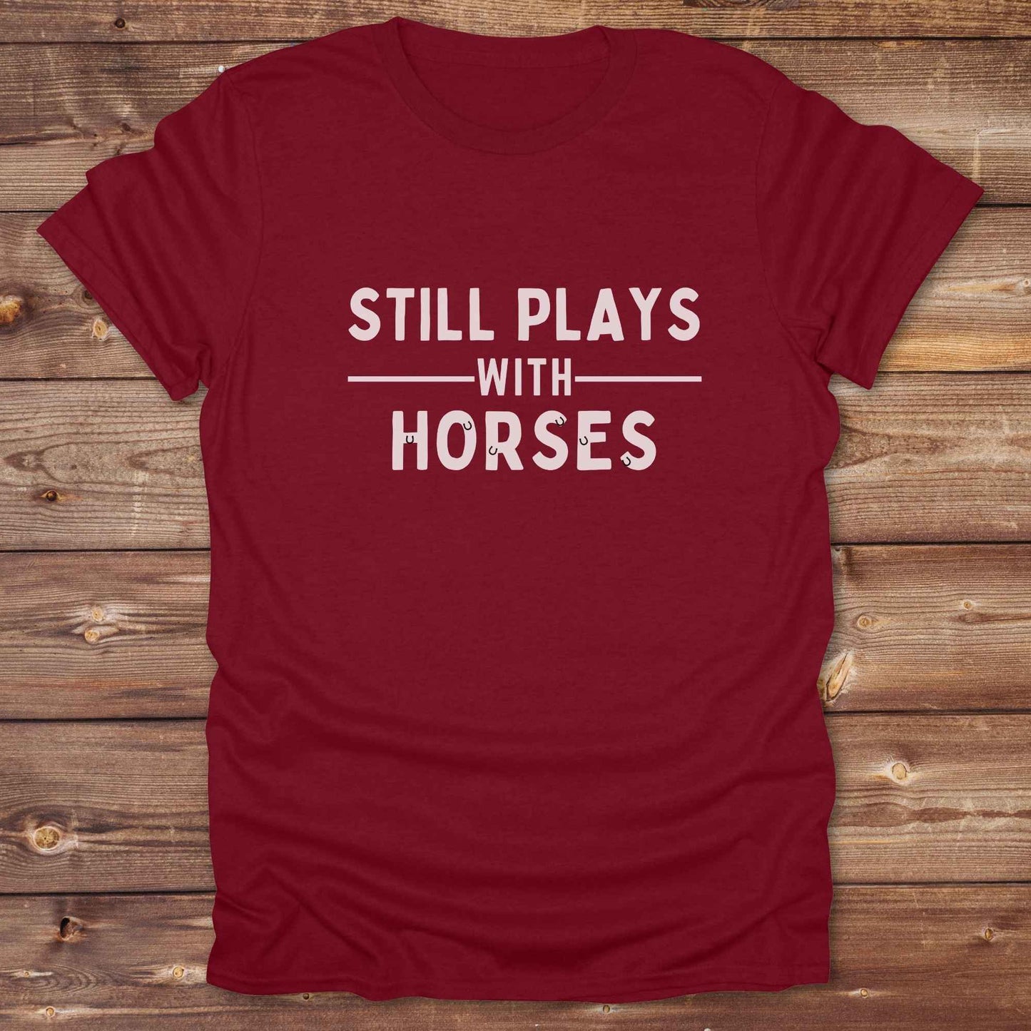 Fun western t-shirt for horse lovers and cowgirls. Western cowgirl graphic tee with horse design. Cowboy humor t-shirt for rodeo and country lovers. Horse lover funny t-shirt with western theme. Country style horse graphic tee for cowboys and cowgirls. Retro style funny western shirt for equestrians. Cute and funny country shirt with horse print. Southern cowgirl funny quote shirt for horse lovers. Still plays with horses.