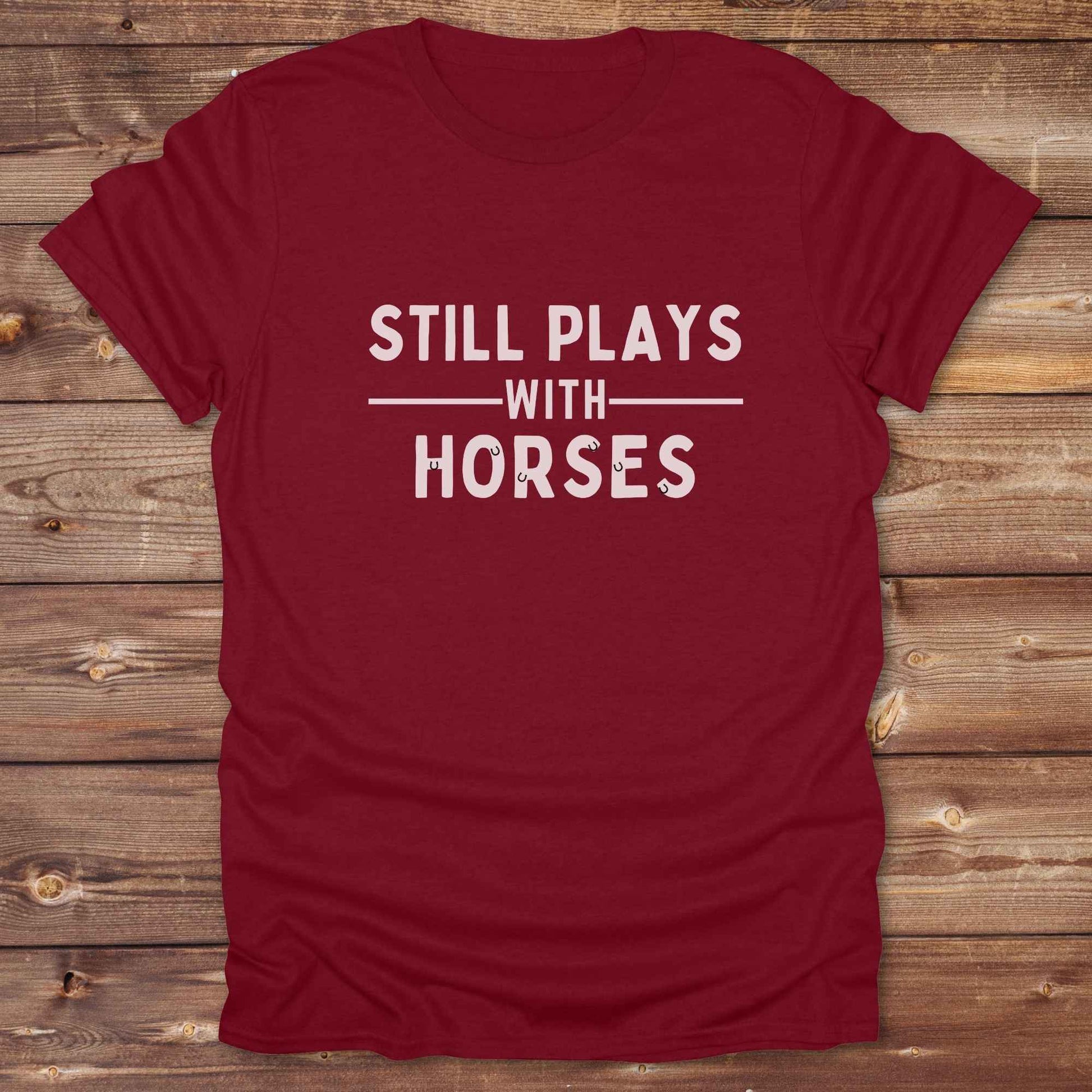 Fun western t-shirt for horse lovers and cowgirls. Western cowgirl graphic tee with horse design. Cowboy humor t-shirt for rodeo and country lovers. Horse lover funny t-shirt with western theme. Country style horse graphic tee for cowboys and cowgirls. Retro style funny western shirt for equestrians. Cute and funny country shirt with horse print. Southern cowgirl funny quote shirt for horse lovers. Still plays with horses.